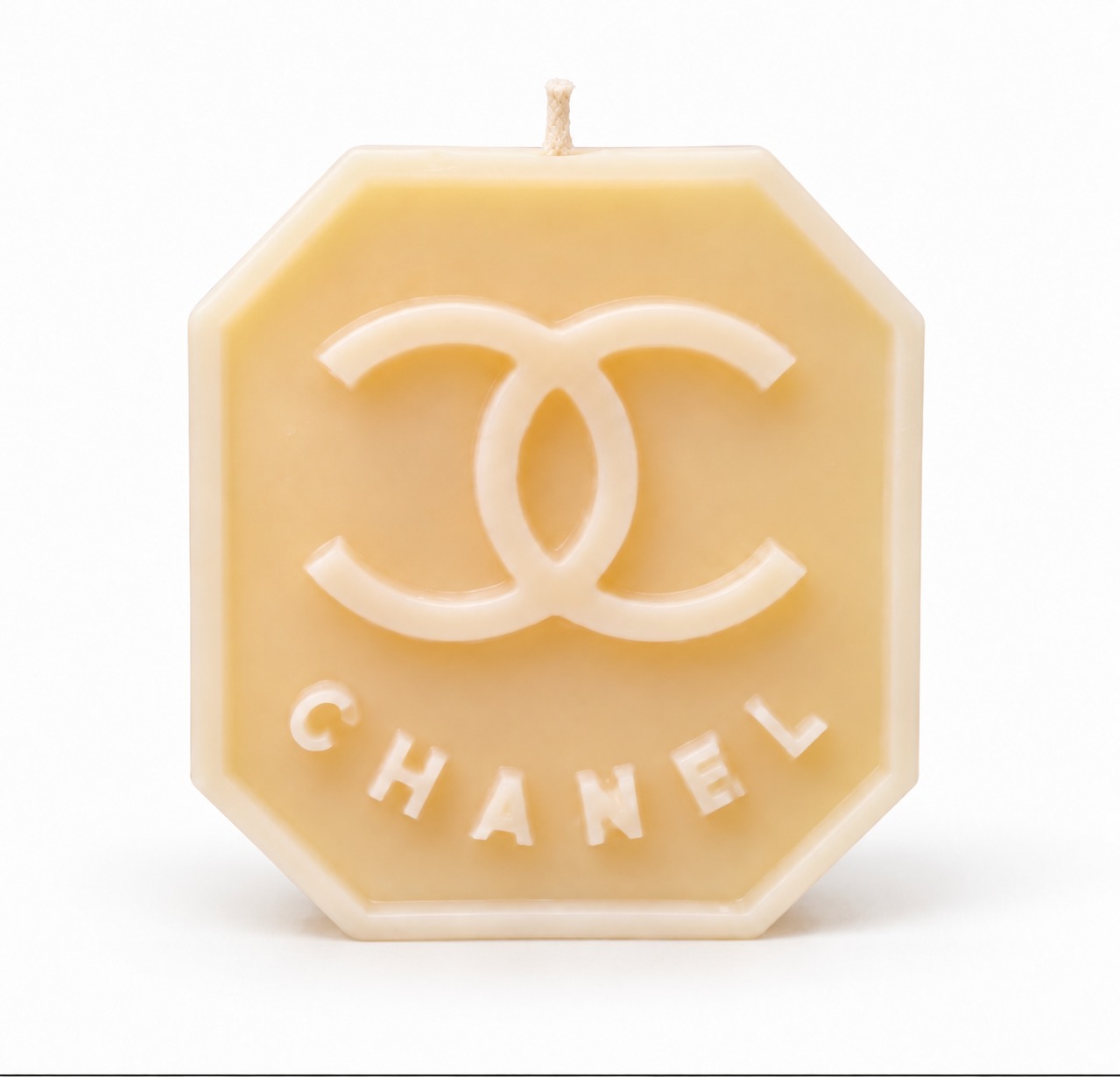 Mini cream octagon candle with a centered wick