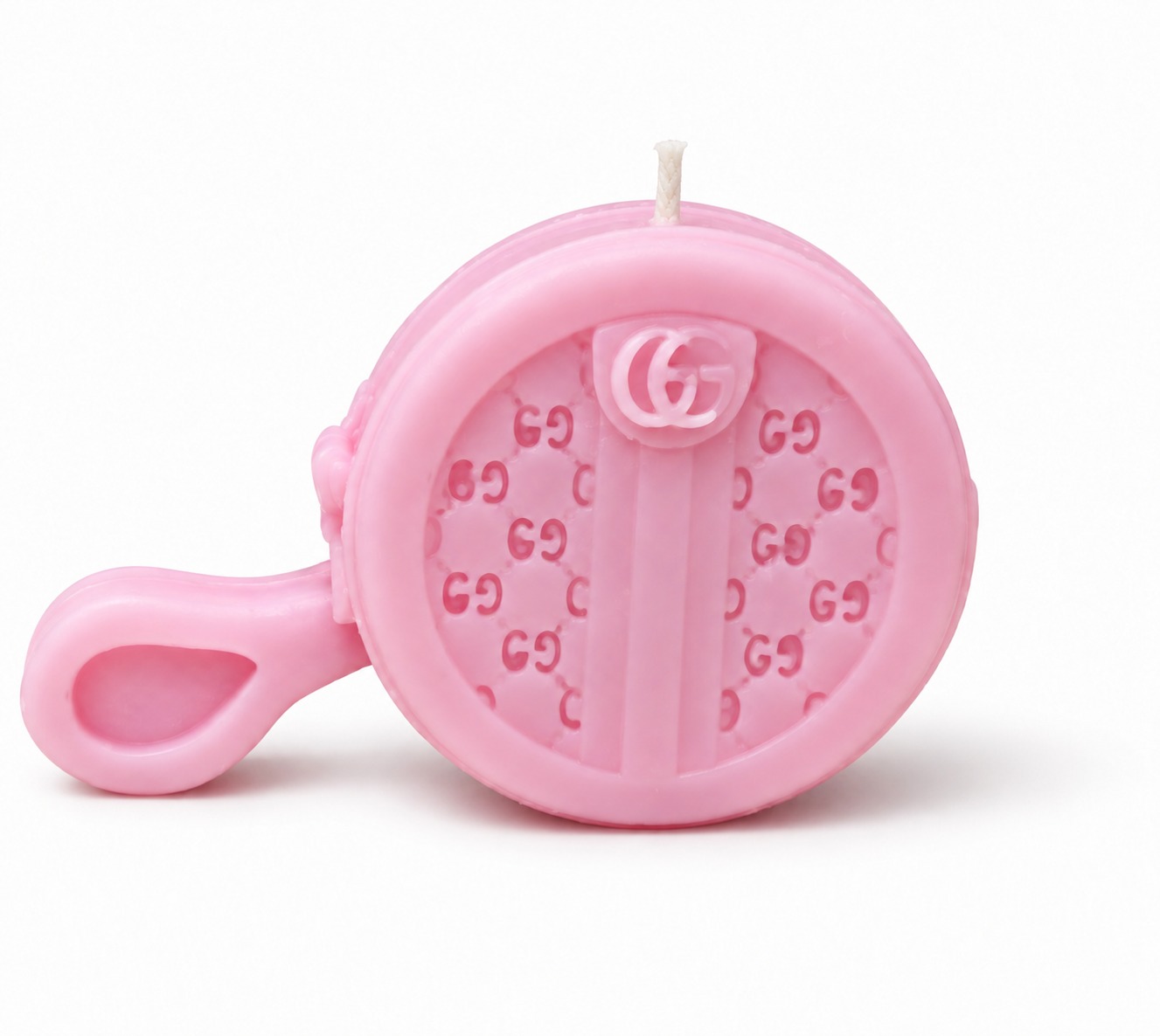 Mini pink quilted candle with a centered wick